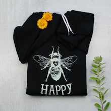 Load image into Gallery viewer, Bee happy black zip up hoodie in black with props